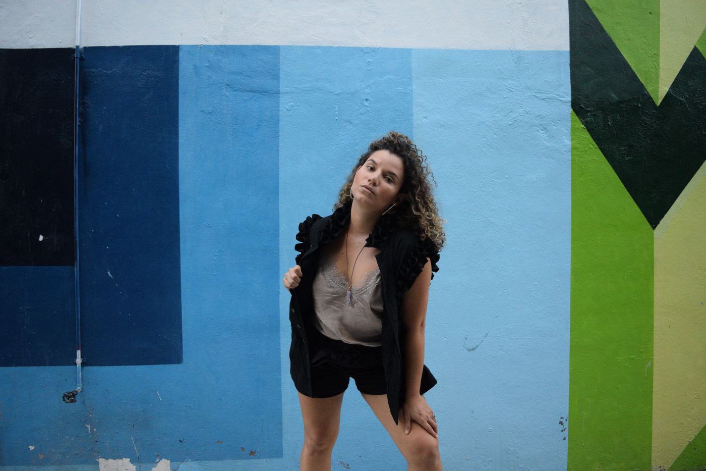 Mau Pino against blue wall